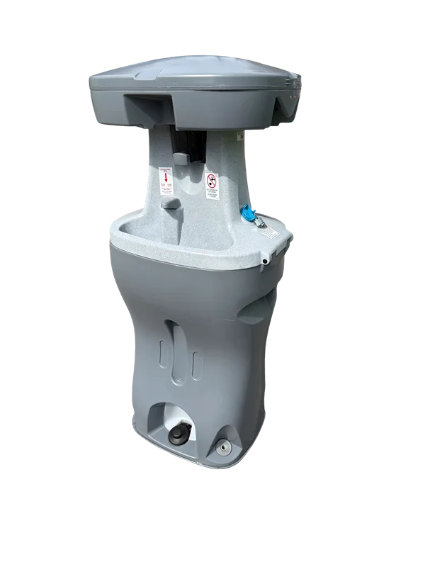 A freestanding, grey, dual-sided portable handwashing station featuring foot pumps at the base, sink basins, and a top dispenser section.